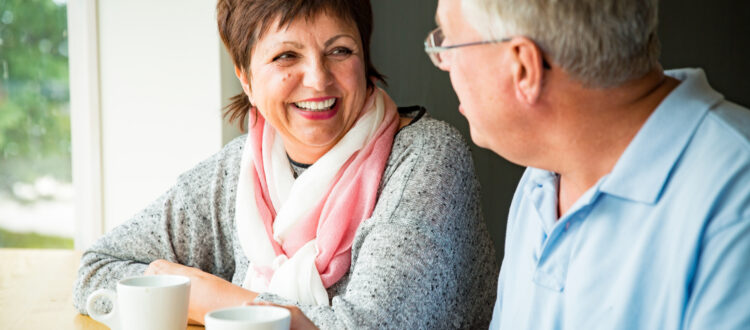 A couple talking over a coffee.