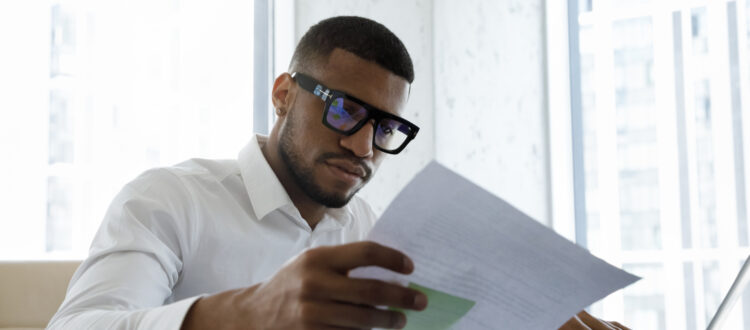 A man looking through some paperwork.