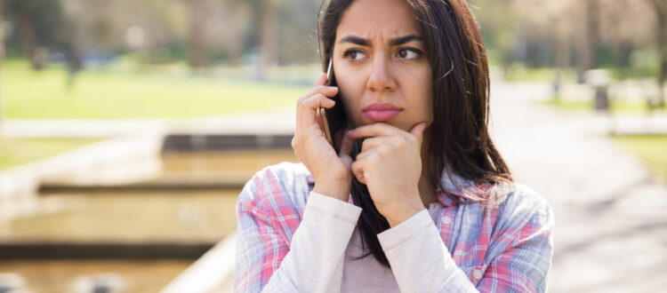 Lady looking concerned about a phone call