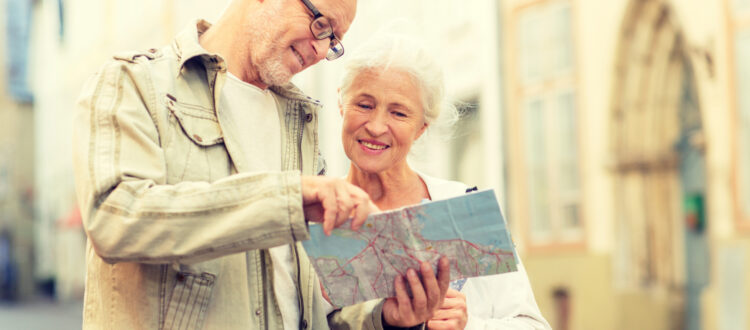 A couple looking at a map while on holiday.