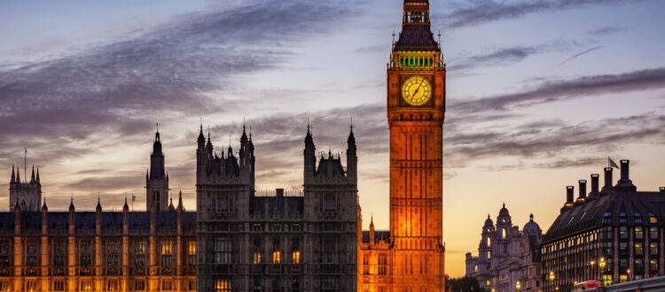 An external image of the Palace of Westminster in the evening