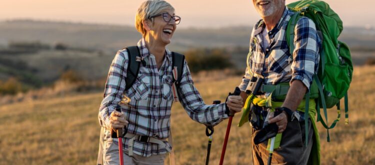 A retired couple hiking.