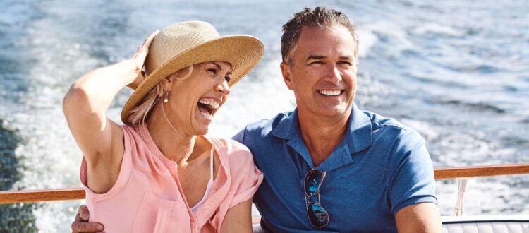 A couple on a yacht cruise.