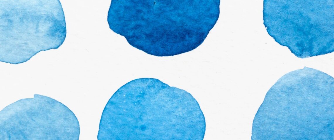 A set of six watercolour blue circles in different shades.