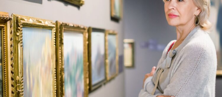 A woman looking at art in a gallery.