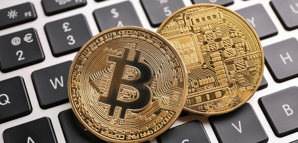 Depiction of physical bitcoins on a keyboard.