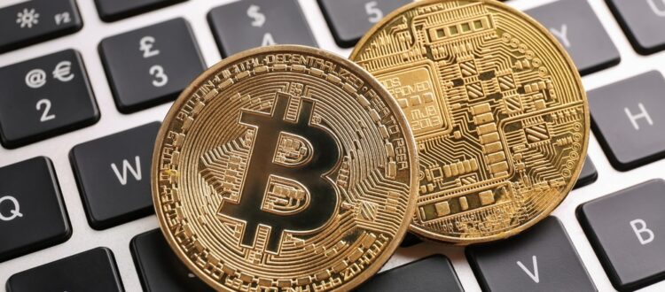 Depiction of physical bitcoins on a keyboard.