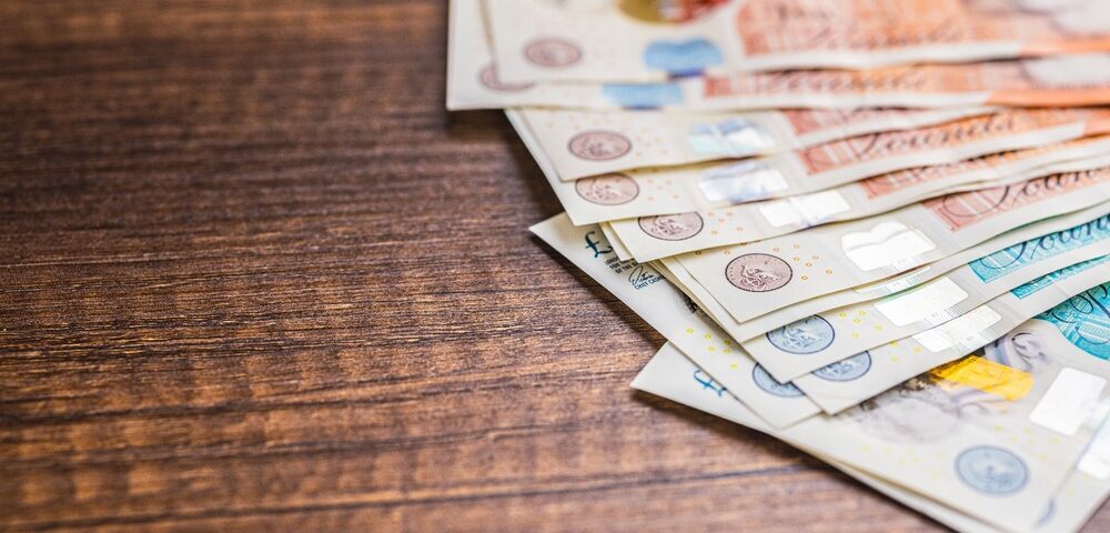 UK bank notes on a table.